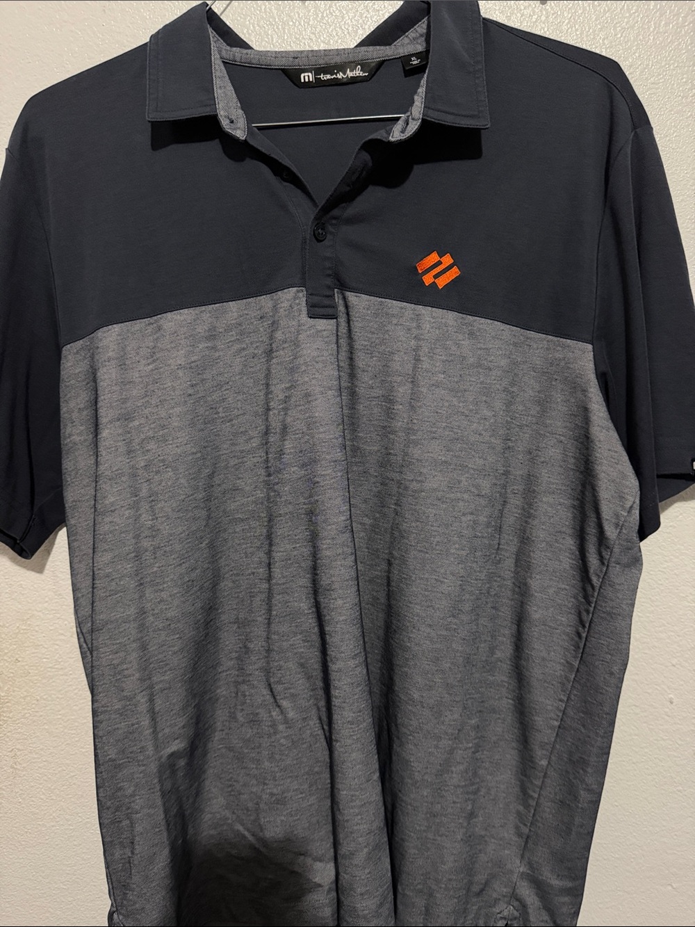 Travis Mathew Men's Two-Tone Polo in Charcoal and Heather Gray with Orange Logo